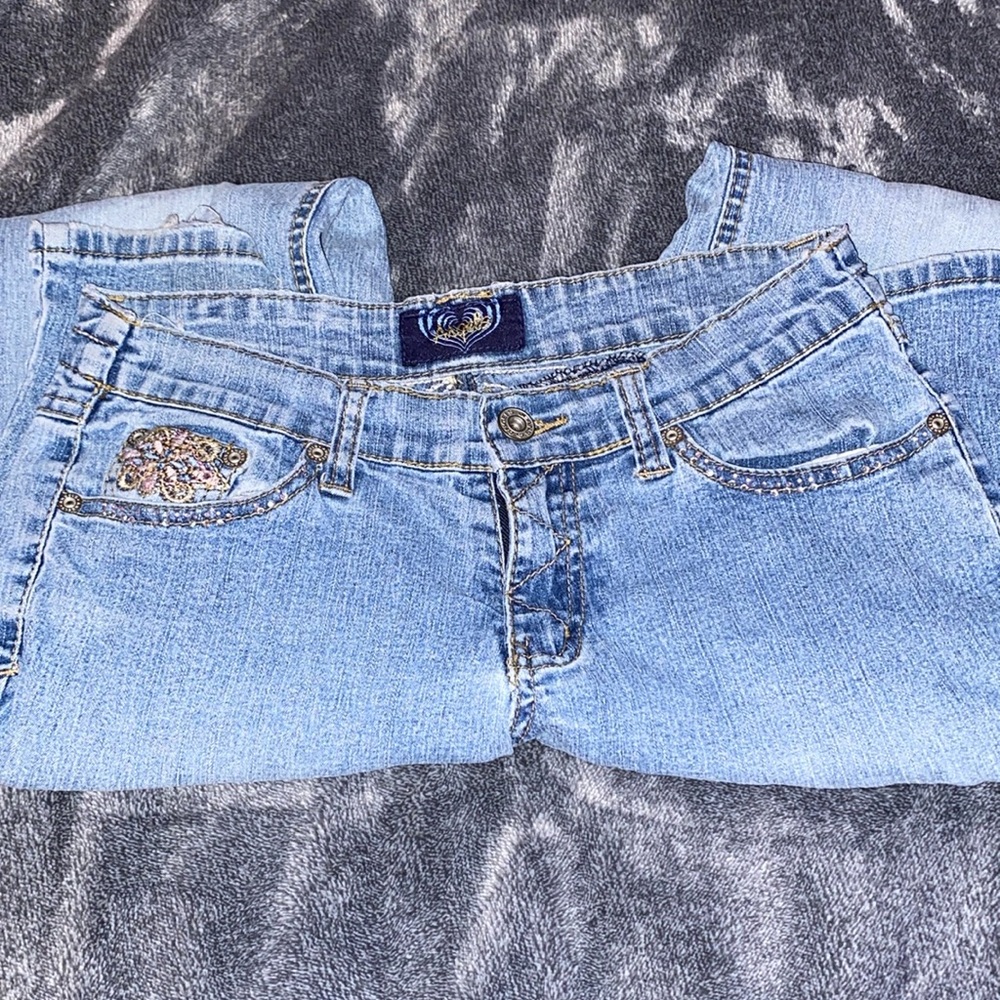 Angels flared jeans, a little baggy, very colorful with the gems.